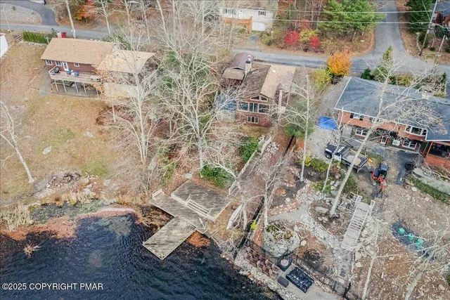 an aerial view of residential house with outdoor space
