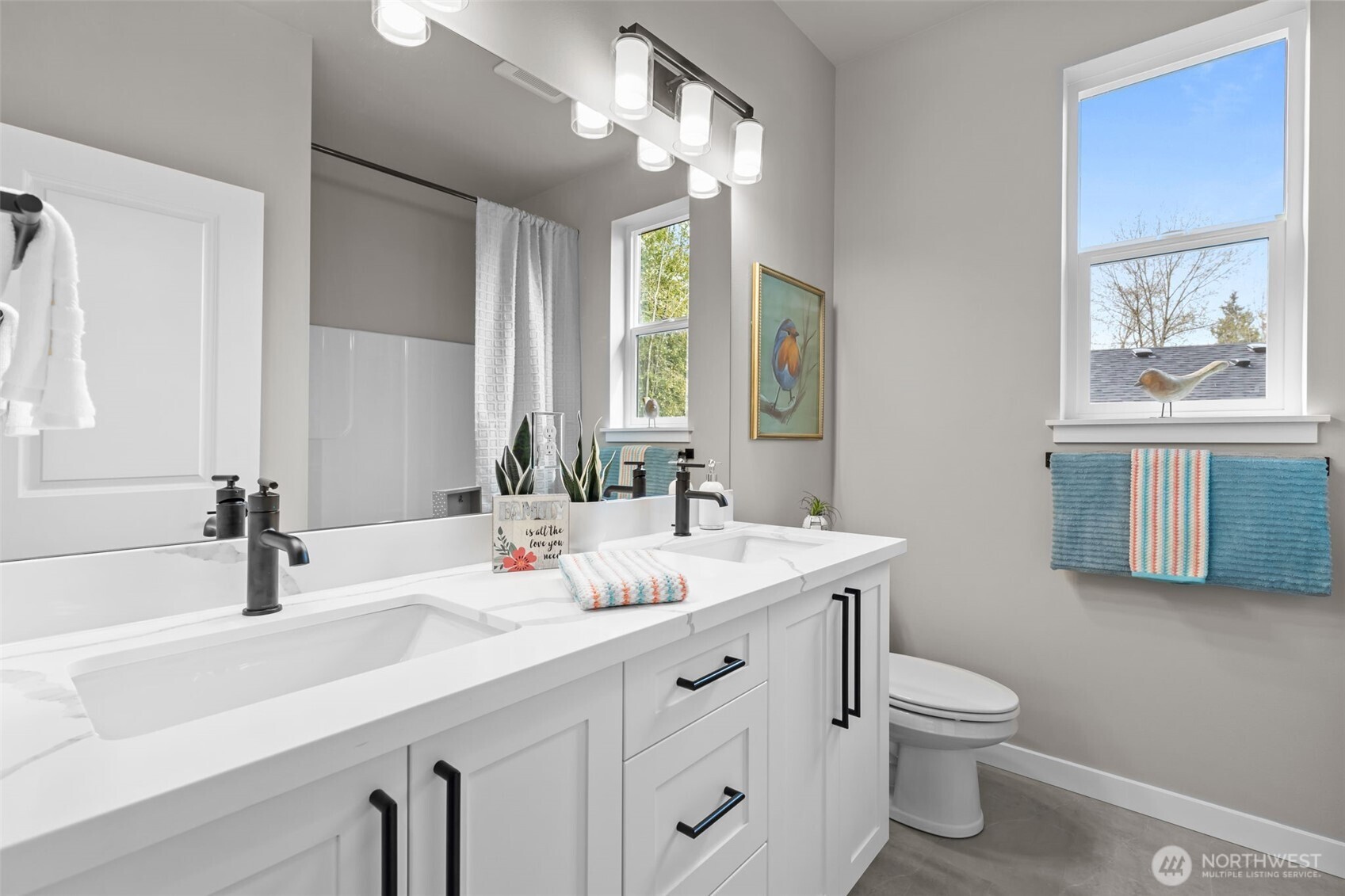 24224 Brier Road Brier, WA 98036 - Photo 12 of 19 a bathroom with a sink double vanity and a toilet