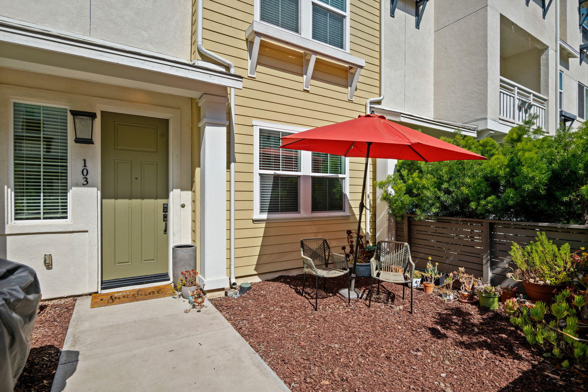 507 Bolinas Way, Unit 103 Goleta, CA 93117 - Photo 2 of 28 a backyard of a house with yard fire pit and outdoor seating