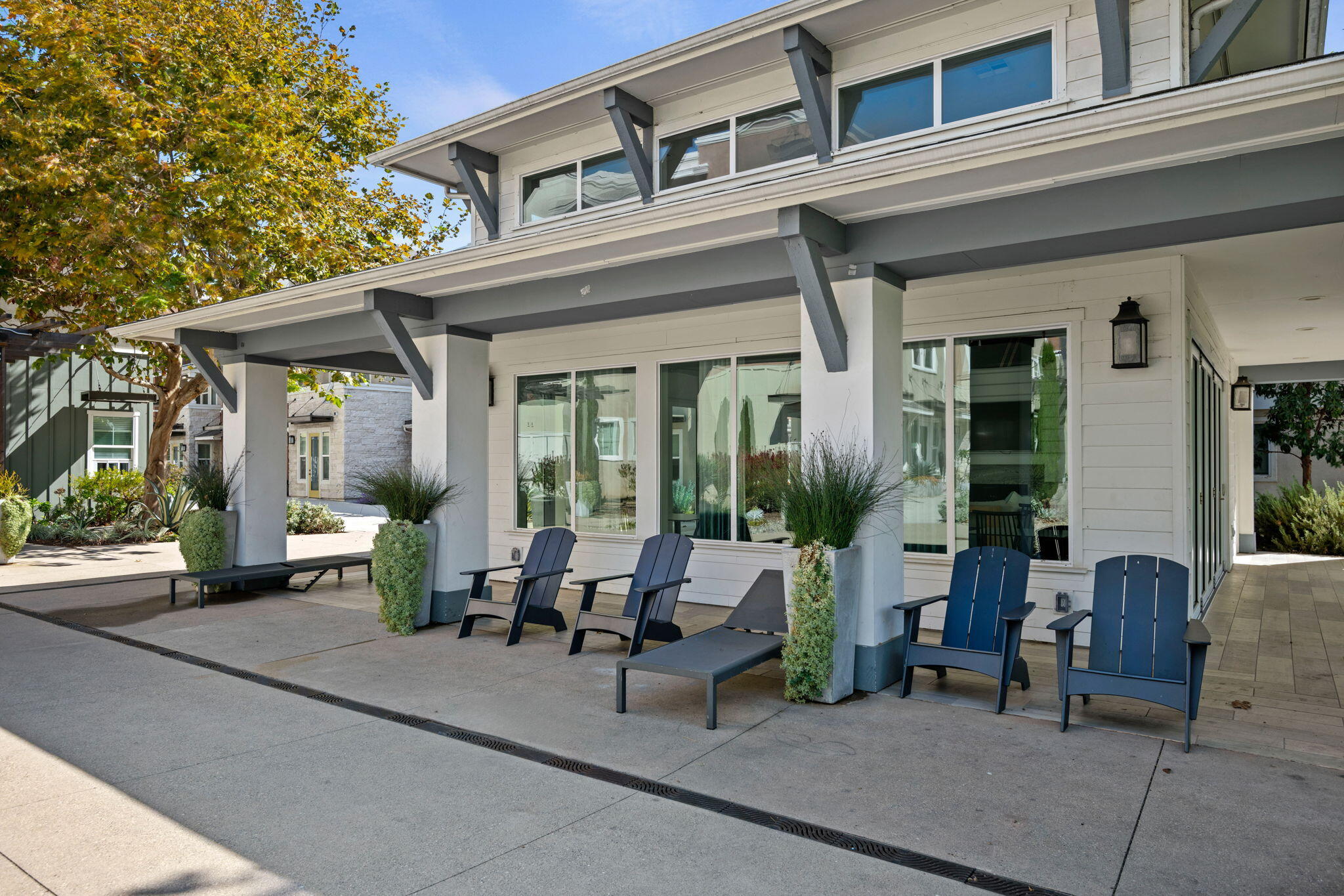 507 Bolinas Way, Unit 103 Goleta, CA 93117 - Photo 24 of 28 a view of a patio with couches table and chairs and potted plants