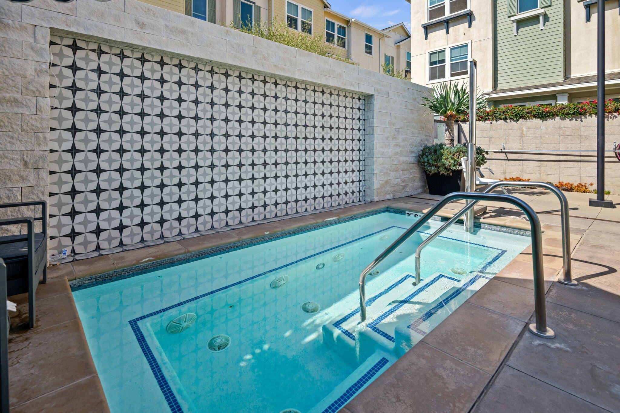 507 Bolinas Way, Unit 103 Goleta, CA 93117 - Photo 27 of 28 a view of a swimming pool with a bench