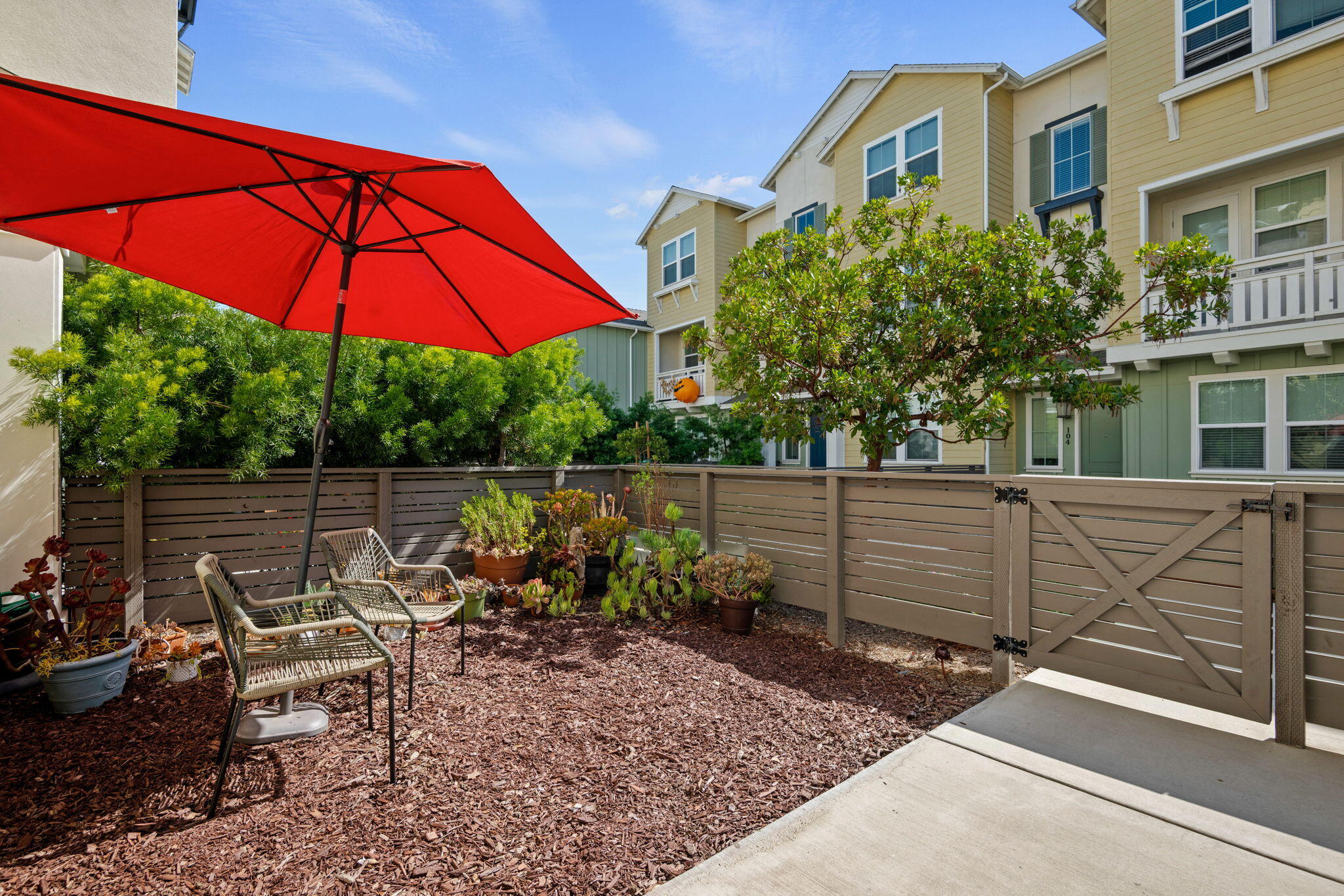 507 Bolinas Way, Unit 103 Goleta, CA 93117 - Photo 3 of 28 a view of a chair and tables in the backyard