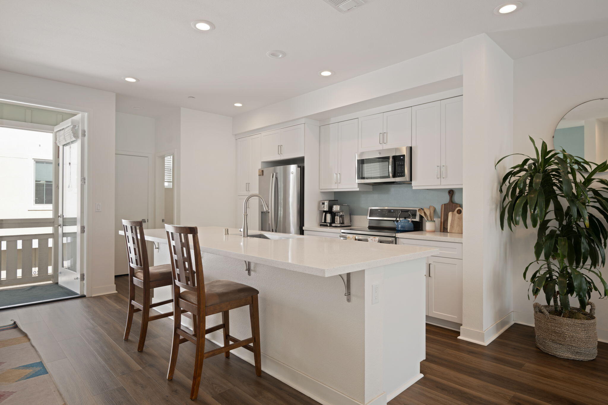 507 Bolinas Way, Unit 103 Goleta, CA 93117 - Photo 4 of 28 a kitchen with furniture a refrigerator and a potted plant