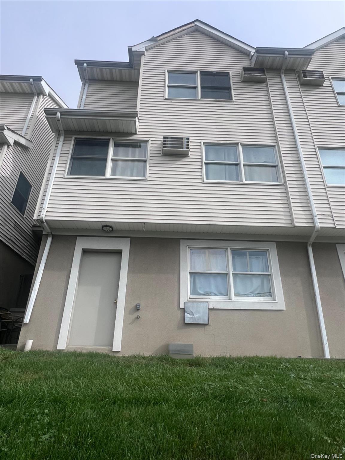 11 Prospect Gardens Spring Valley, NY 10977 - Photo 1 of 1 a front view of a house with garden