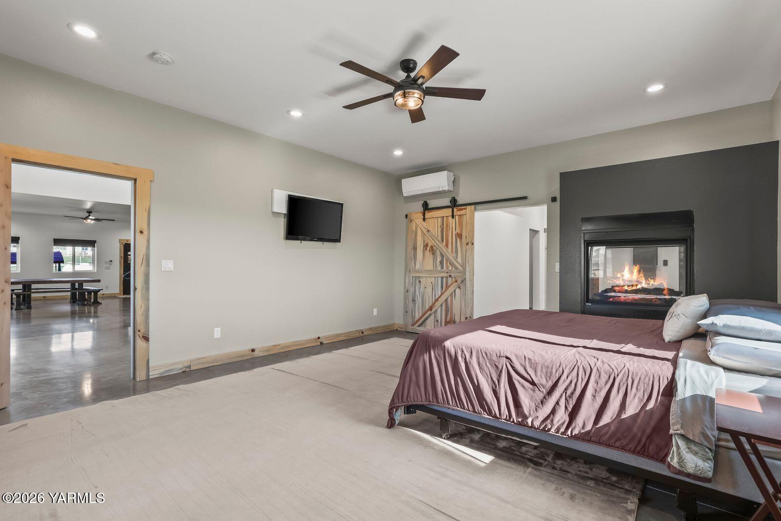 190 Gopher Road Selah, WA 98942 - Photo 16 of 48 a bedroom with a bed and a ceiling fan