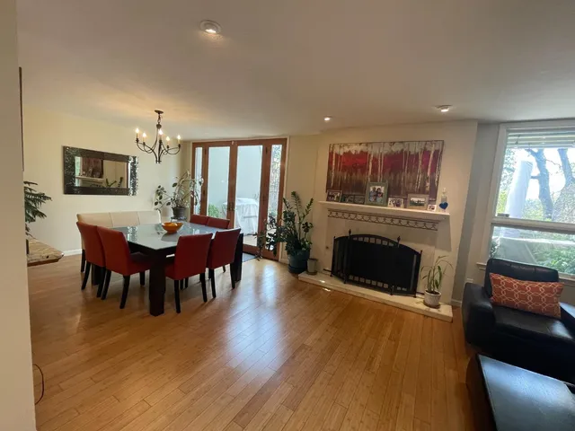 a kitchen with stainless steel appliances granite countertop a sink refrigerator and cabinets
