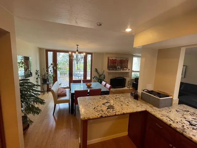 a view of kitchen island with furniture and wooden floor