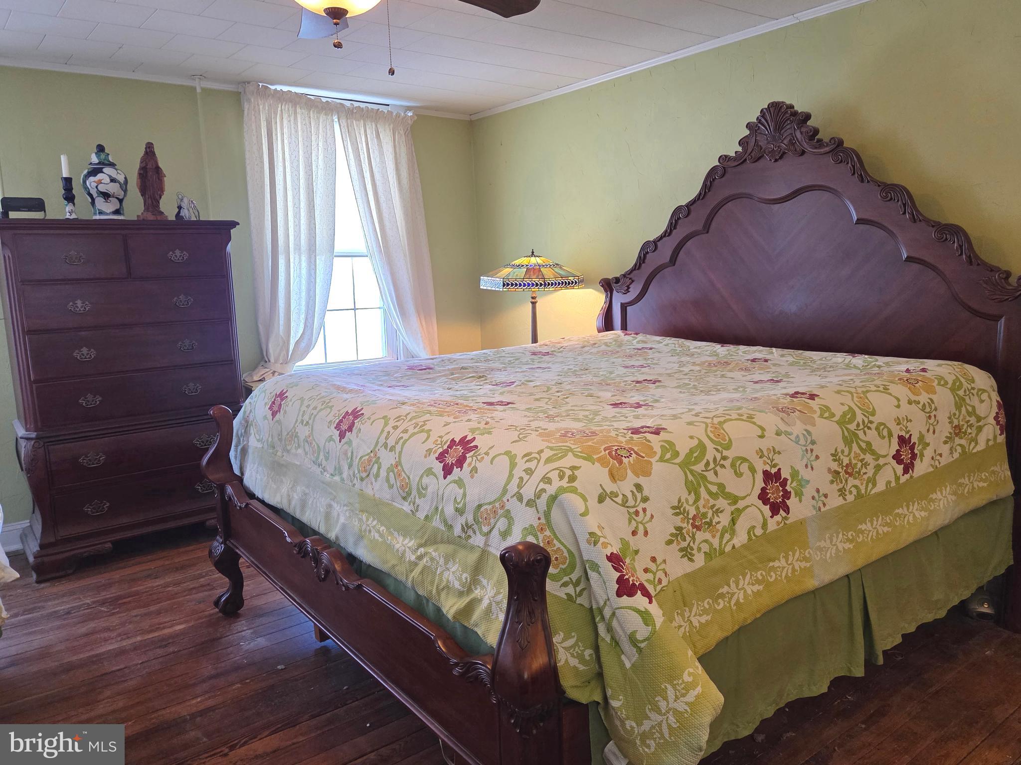6500 Old Harford Road Baltimore, MD 21214 - Photo 14 of 28 a bedroom with a bed and window