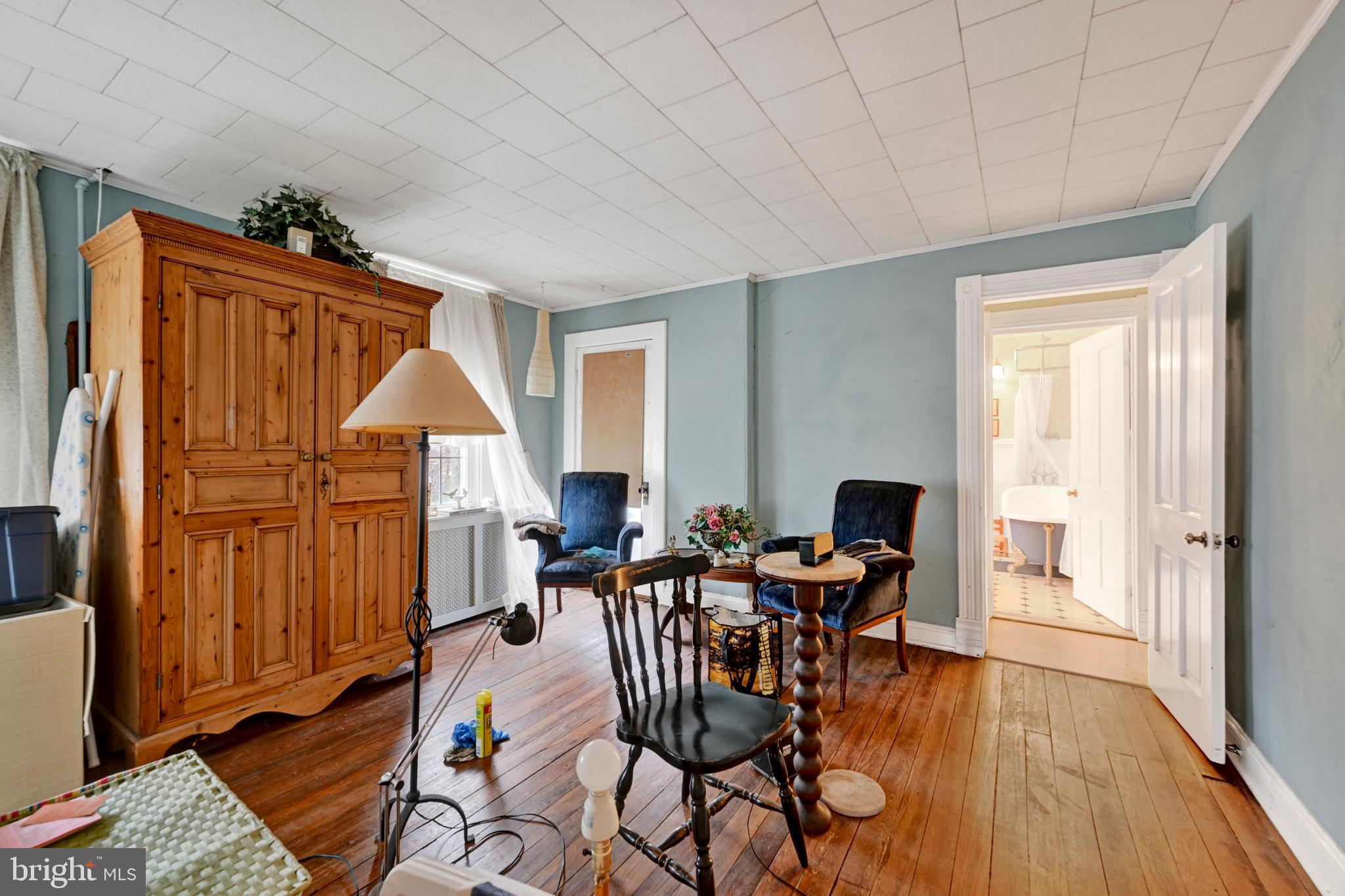 6500 Old Harford Road Baltimore, MD 21214 - Photo 15 of 28 a view of a dining room with furniture window and wooden floor
