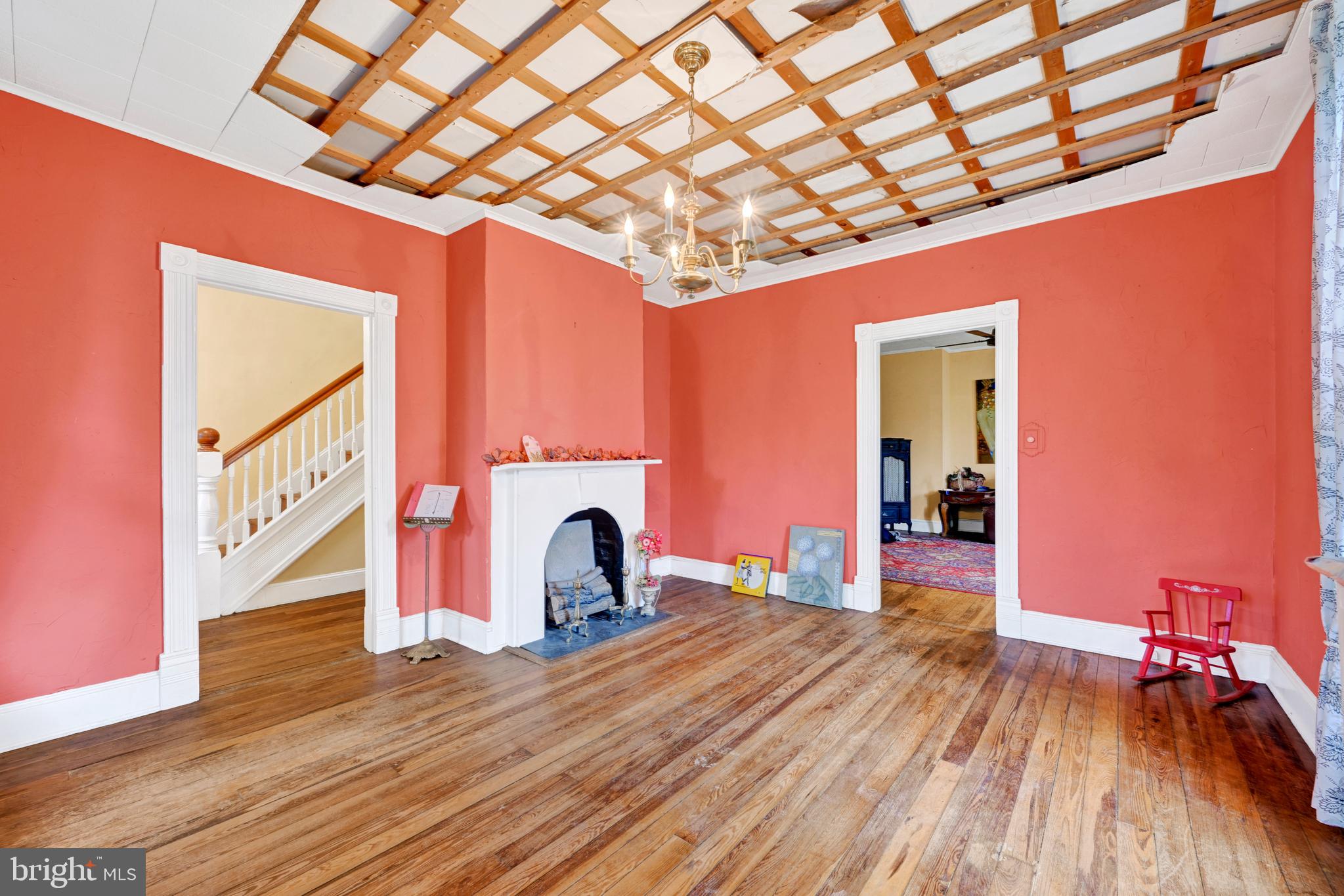 6500 Old Harford Road Baltimore, MD 21214 - Photo 8 of 28 a view of a room with wooden floor and staircase