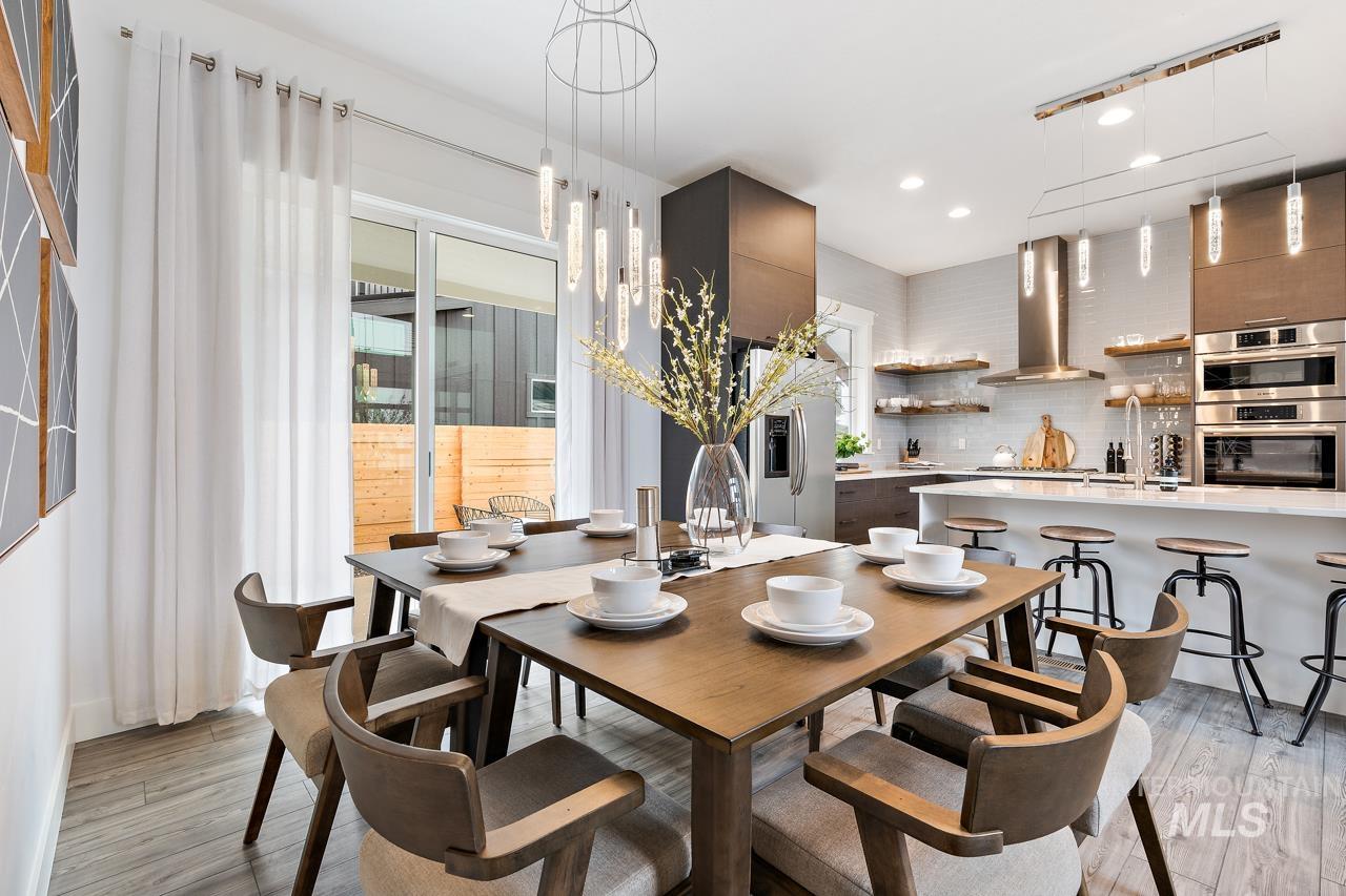 599 West Warren Street Boise, ID 83706 - Photo 8 of 41 Open-concept dining area featuring wood-finish flooring