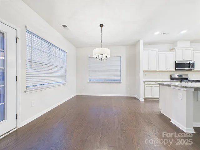 a view of a kitchen with electric appliances