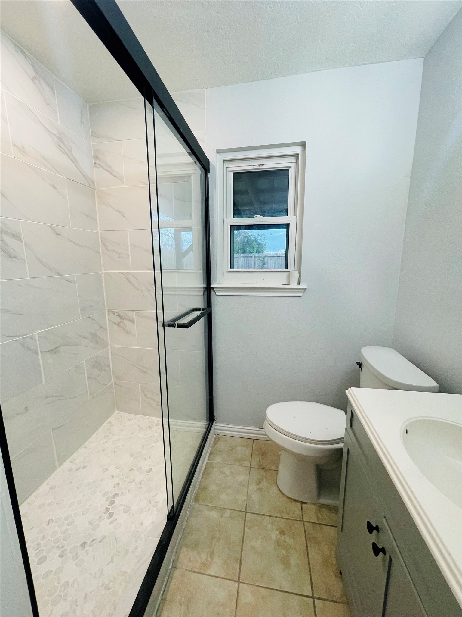 1225 Clover Drive Angleton, TX 77515 - Photo 7 of 15 a bathroom with a toilet and a shower