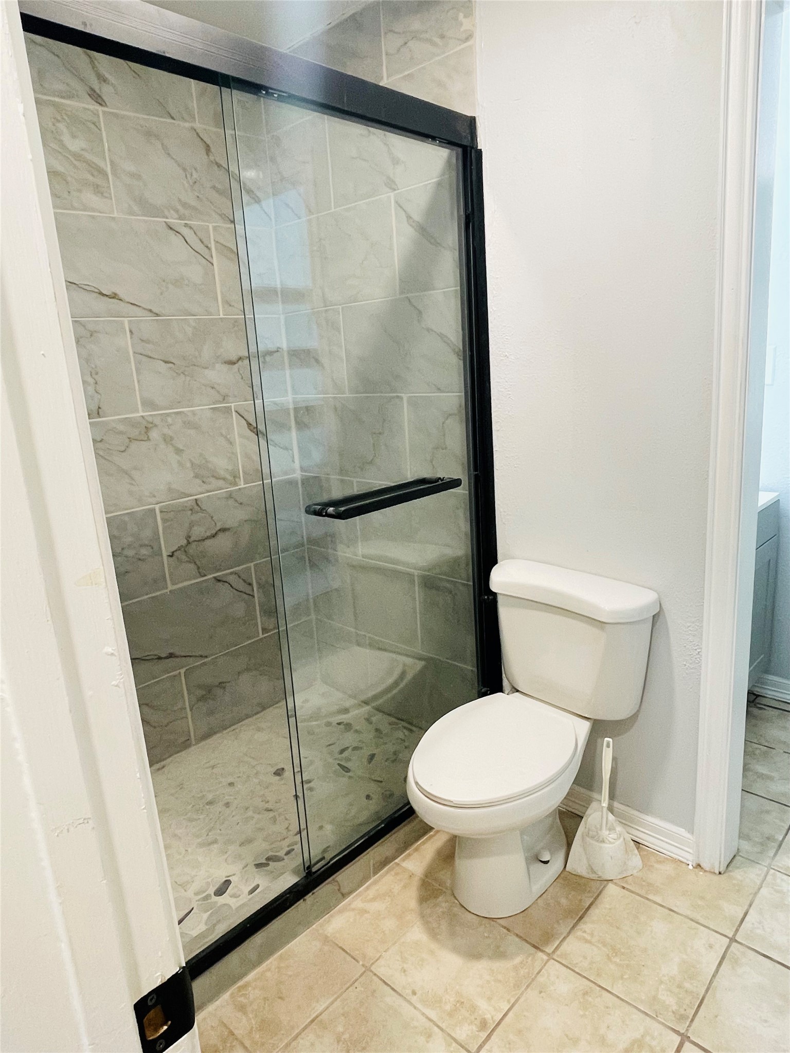 1225 Clover Drive Angleton, TX 77515 - Photo 10 of 15 a bathroom with a toilet and a shower