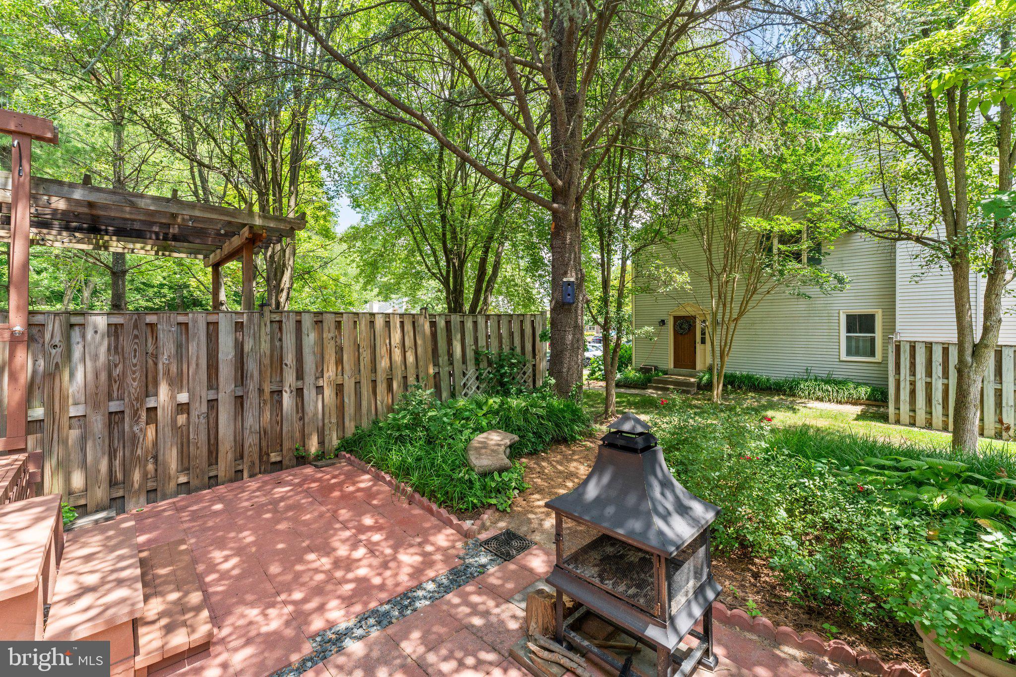 7253 Kousa Lane Springfield, VA 22152 - Photo 41 of 45 Paver patio with fireplace