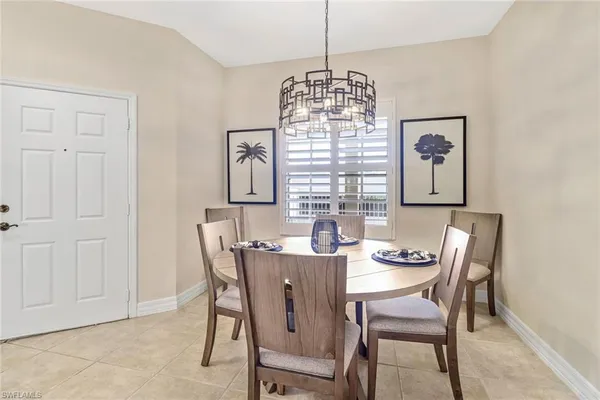 a view of a dining room with furniture window and chandelier