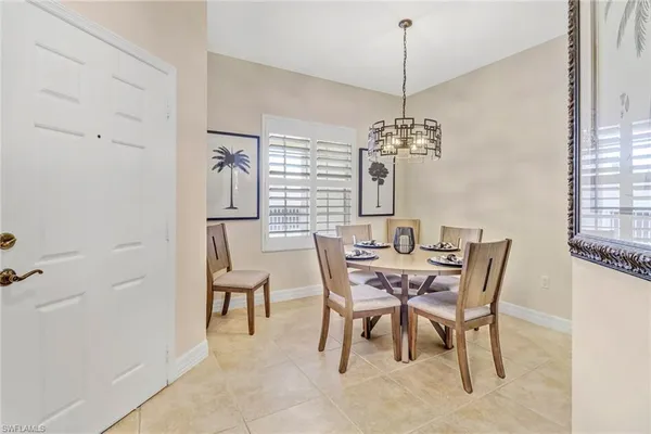 a dining room with furniture and window