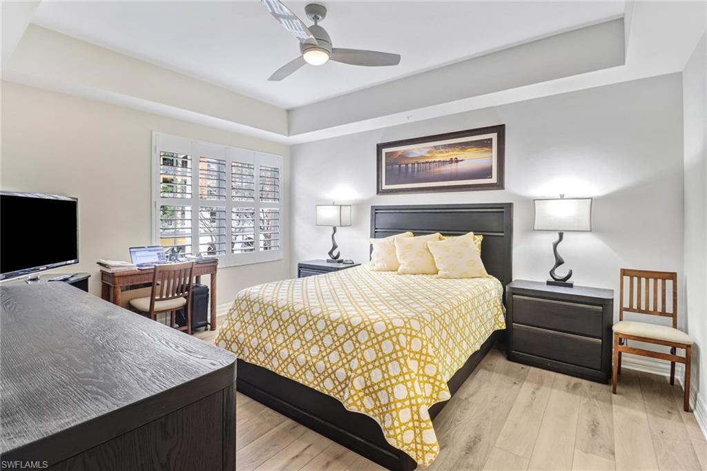 401 Bayfront Place, Unit 3205 Naples, FL 34102 - Photo 14 of 35 a bedroom with bed and a flat screen tv