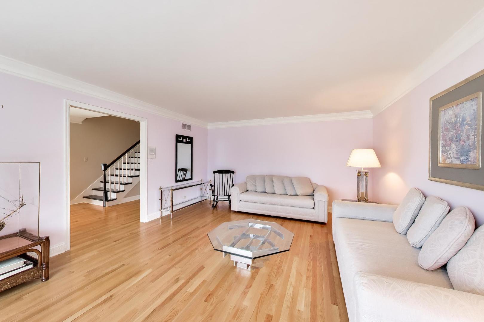 766 Camelot Drive Burr Ridge, IL 60527 - Photo 15 of 48 a living room with furniture and a wooden floor