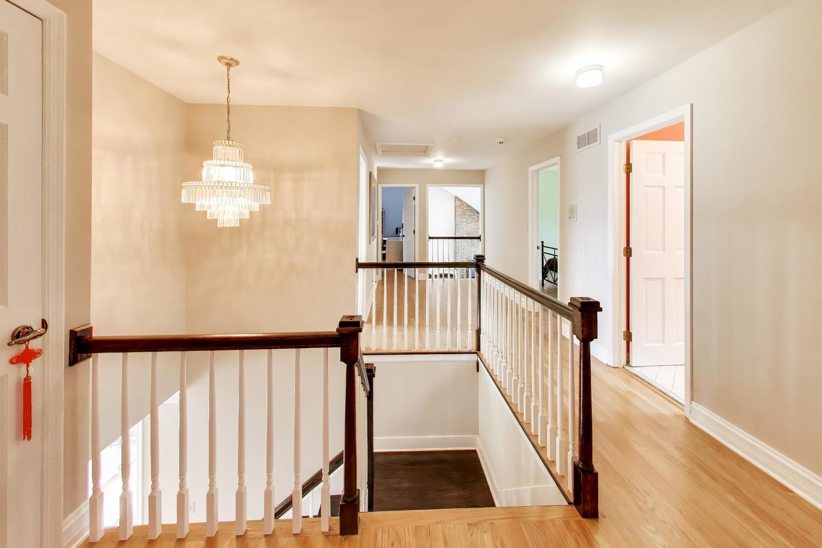 766 Camelot Drive Burr Ridge, IL 60527 - Photo 17 of 48 a view of a hallway with windows