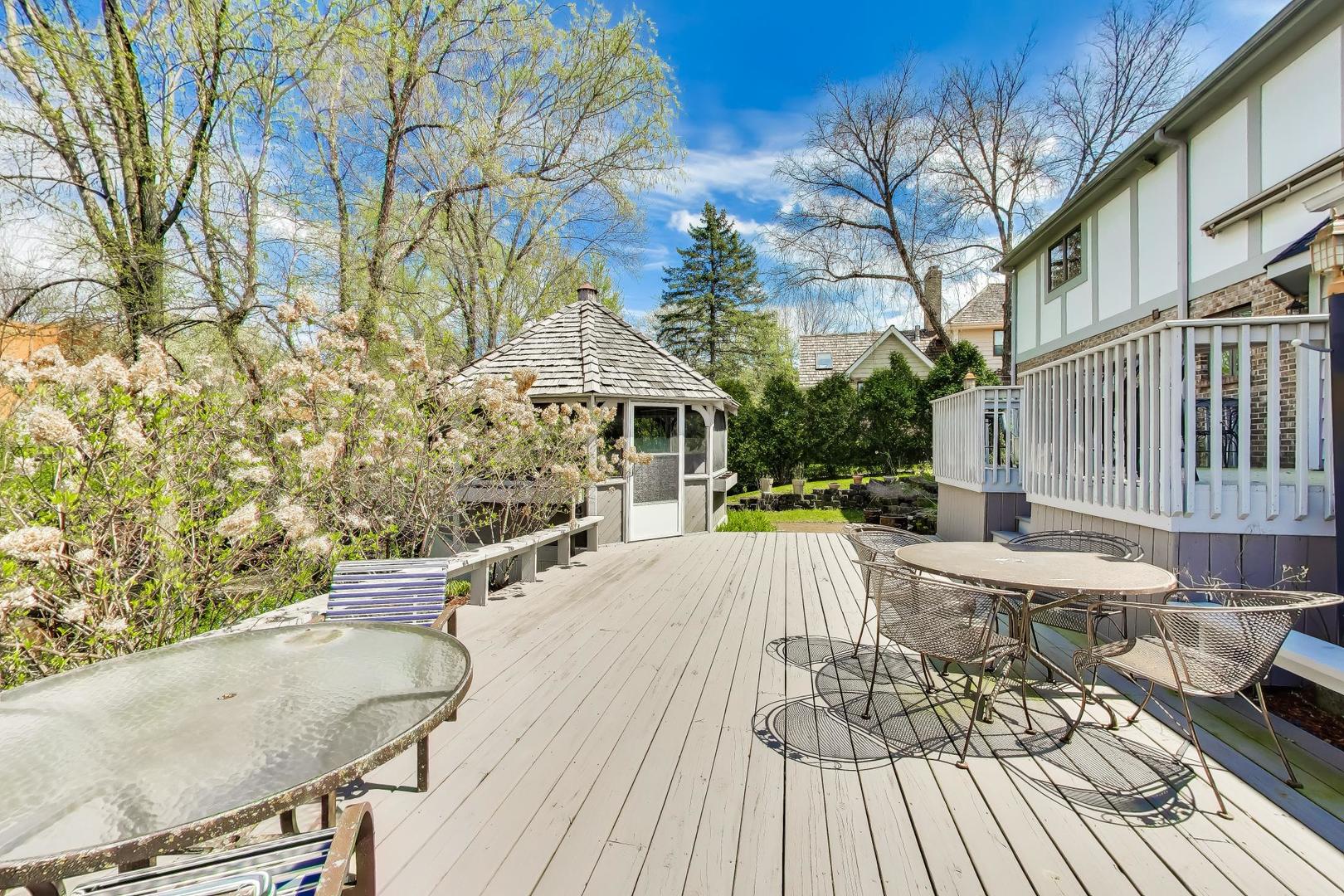 766 Camelot Drive Burr Ridge, IL 60527 - Photo 42 of 48 a view of a patio with couches table and chairs and potted plants