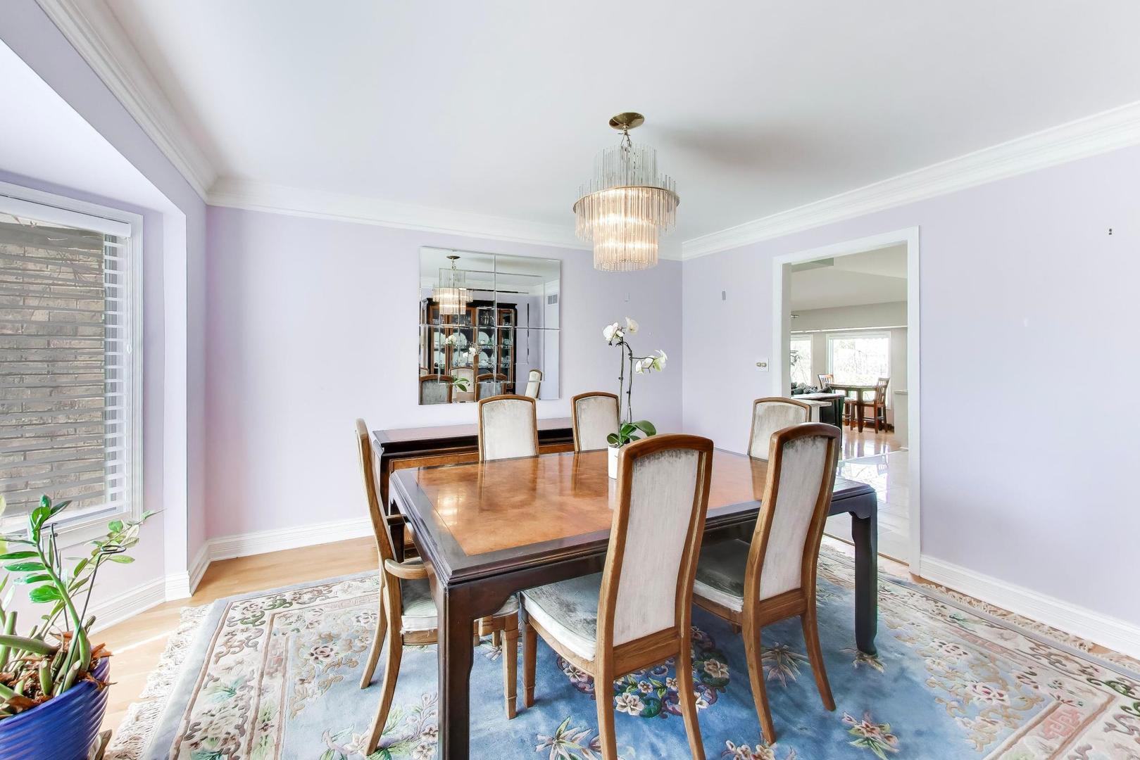 766 Camelot Drive Burr Ridge, IL 60527 - Photo 7 of 48 a view of a dining room with furniture and wooden floor