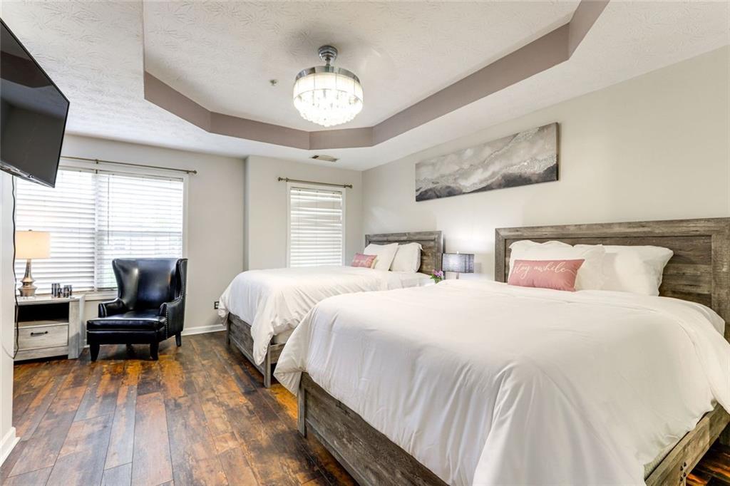 3840 Augustine Place Rex, GA 30273 - Photo 11 of 23 a bedroom with bed and flat tv