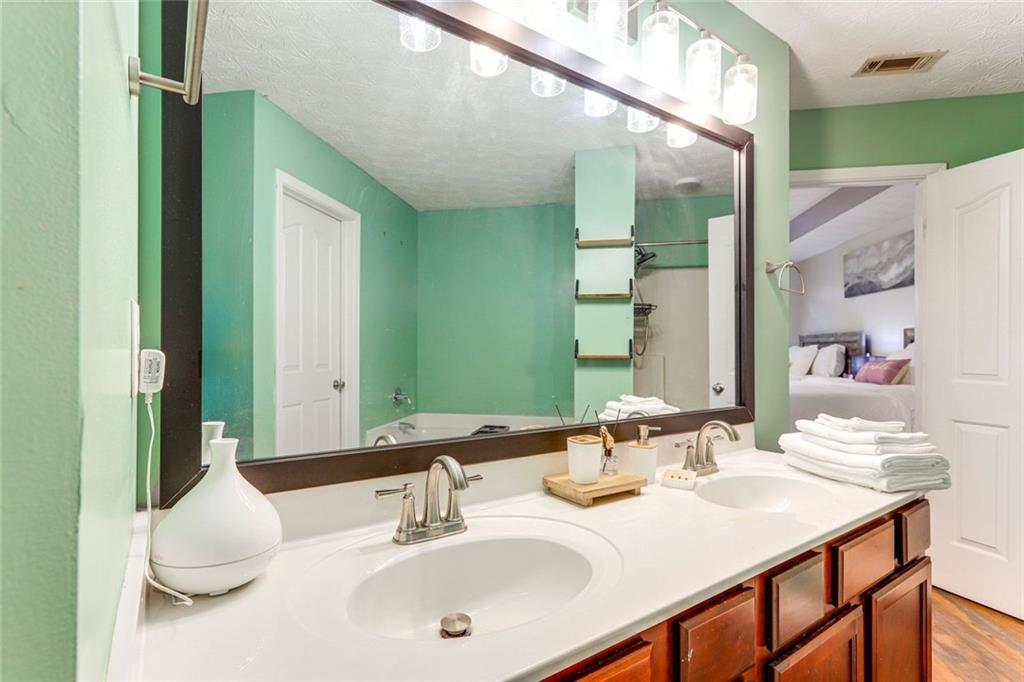 3840 Augustine Place Rex, GA 30273 - Photo 14 of 23 a bathroom with a sink and a mirror