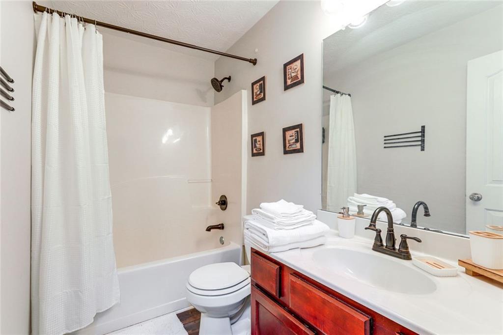 3840 Augustine Place Rex, GA 30273 - Photo 19 of 23 a bathroom with a sink toilet and shower