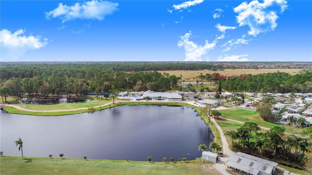 475 Pine Loop Frostproof, FL 33843 - Photo 36 of 40 a view of a lake with a big yard