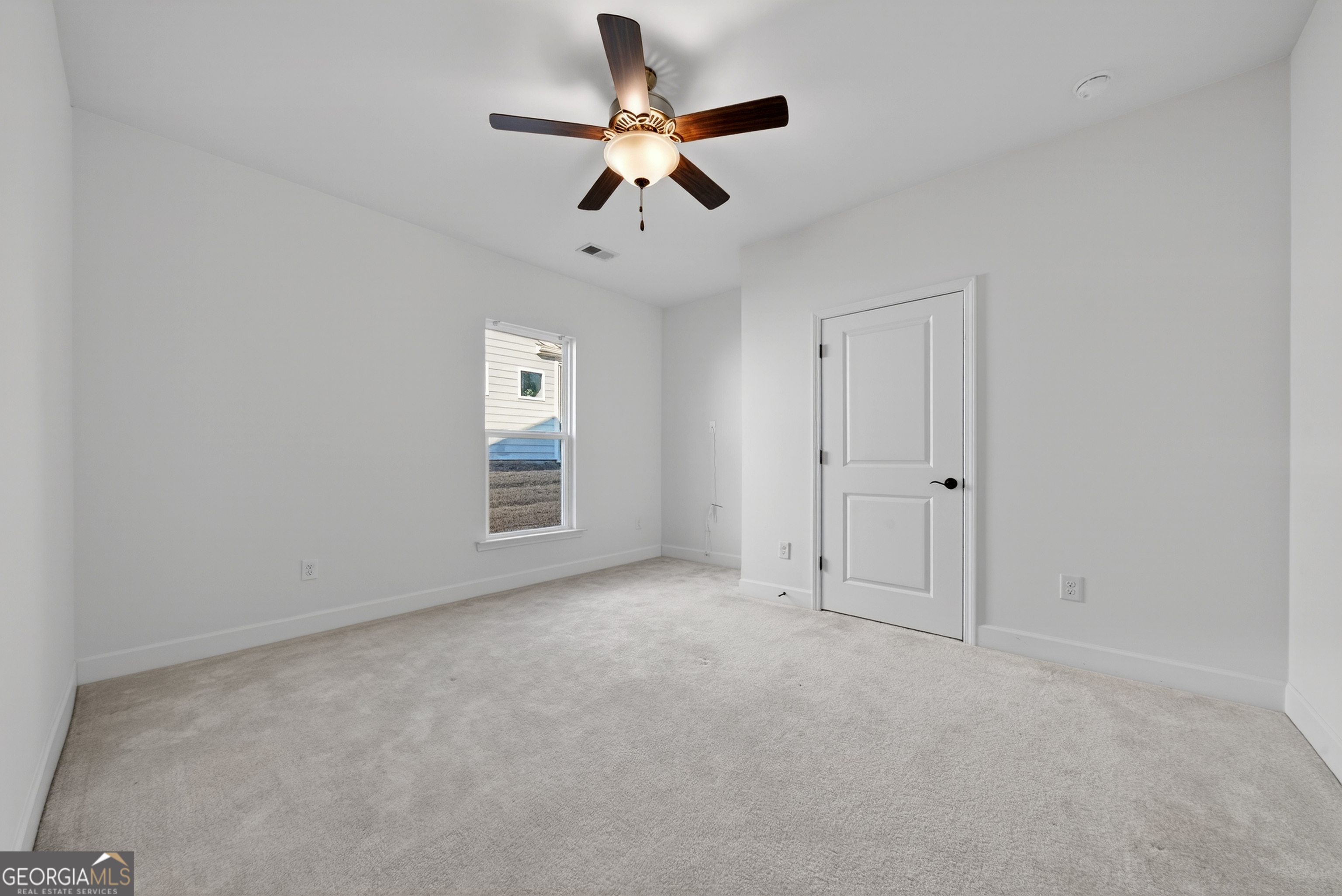 1060 Lone Oak Road Greensboro, GA 30642 - Photo 20 of 26 an empty room with closet and windows