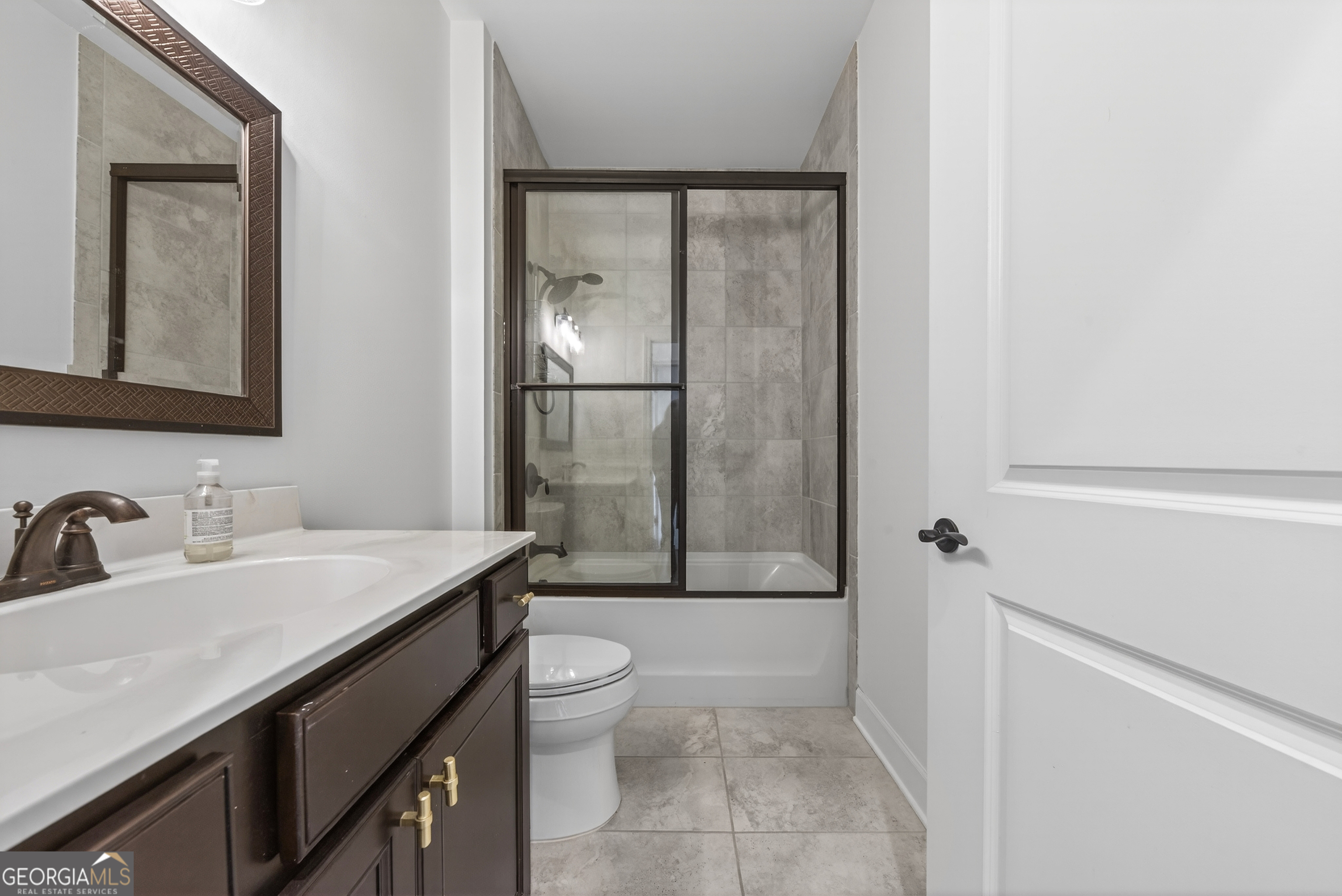 1060 Lone Oak Road Greensboro, GA 30642 - Photo 22 of 26 a bathroom with a sink a toilet and shower