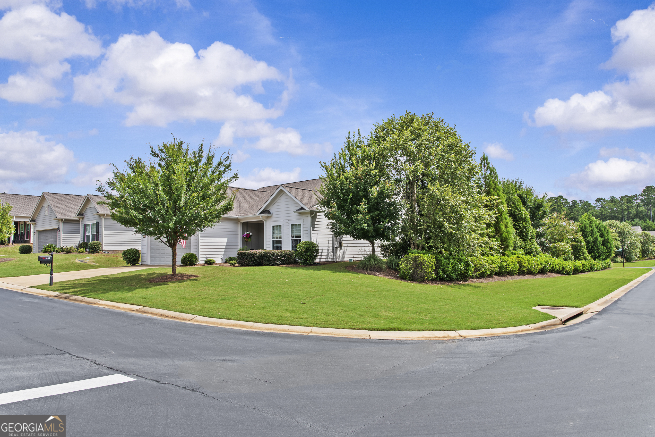 1060 Lone Oak Road Greensboro, GA 30642 - Photo 25 of 26 a view of a house with a big yard and palm trees