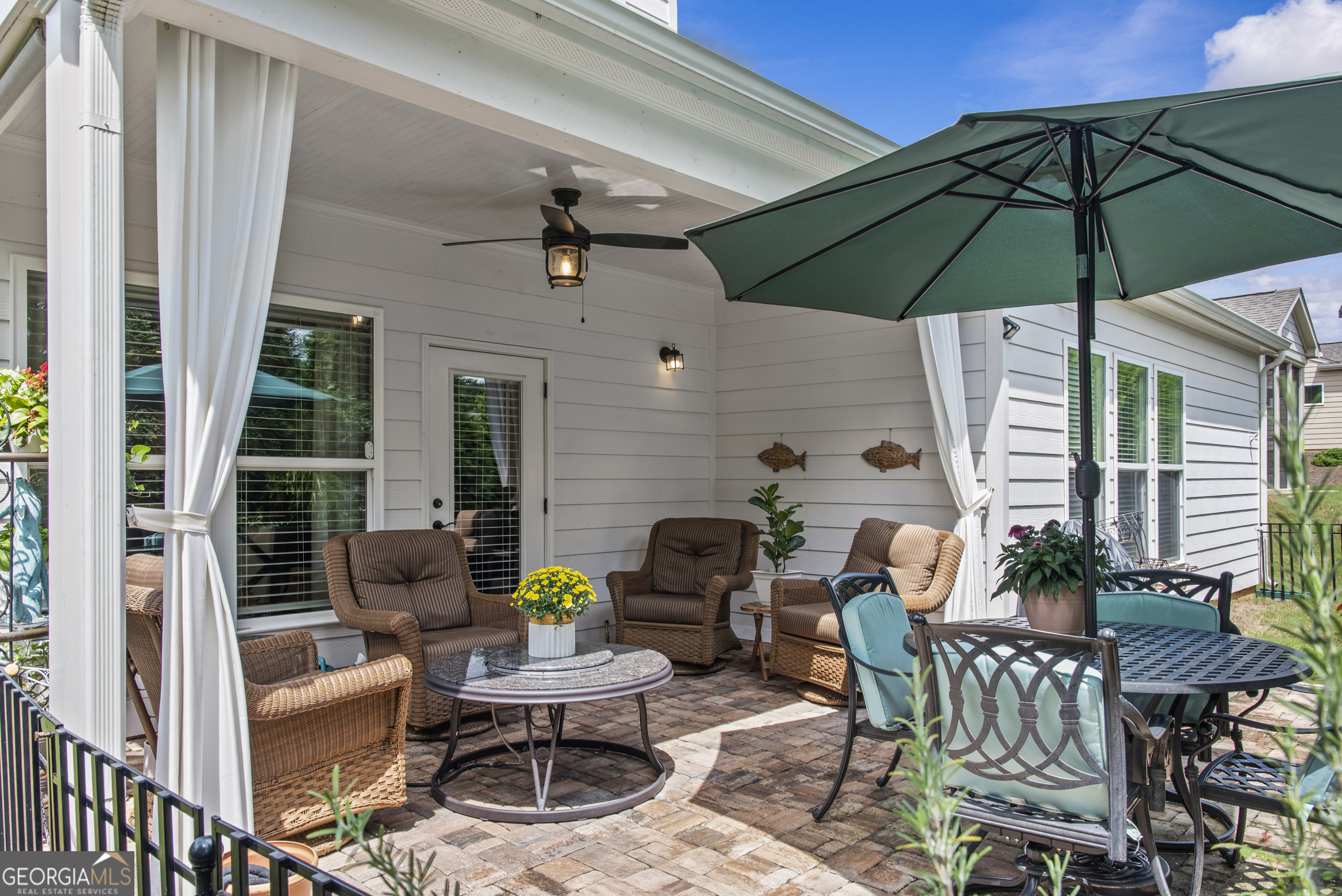 1060 Lone Oak Road Greensboro, GA 30642 - Photo 3 of 26 a patio with a patio table and chairs
