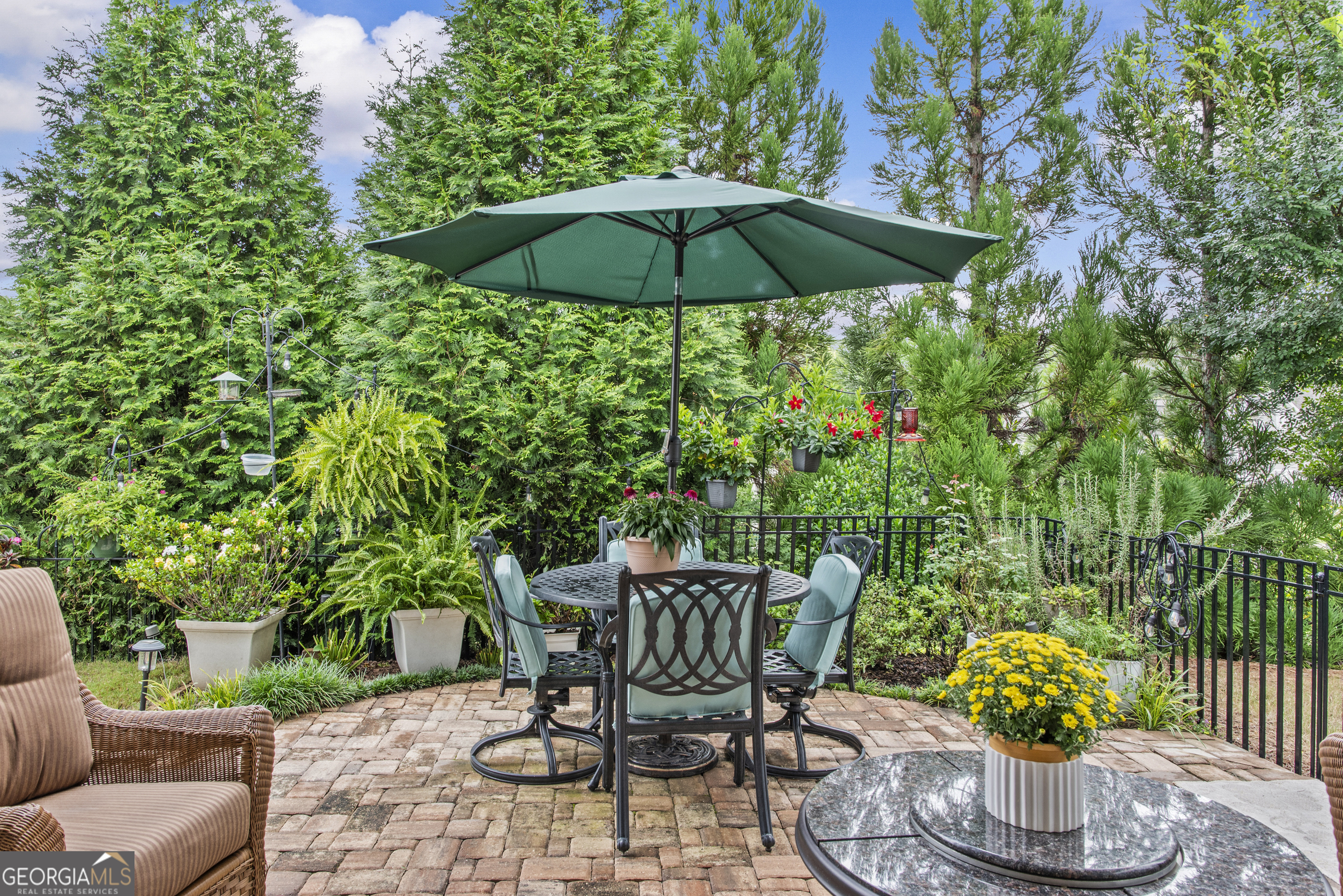1060 Lone Oak Road Greensboro, GA 30642 - Photo 4 of 26 a view of a chairs and table under an umbrella