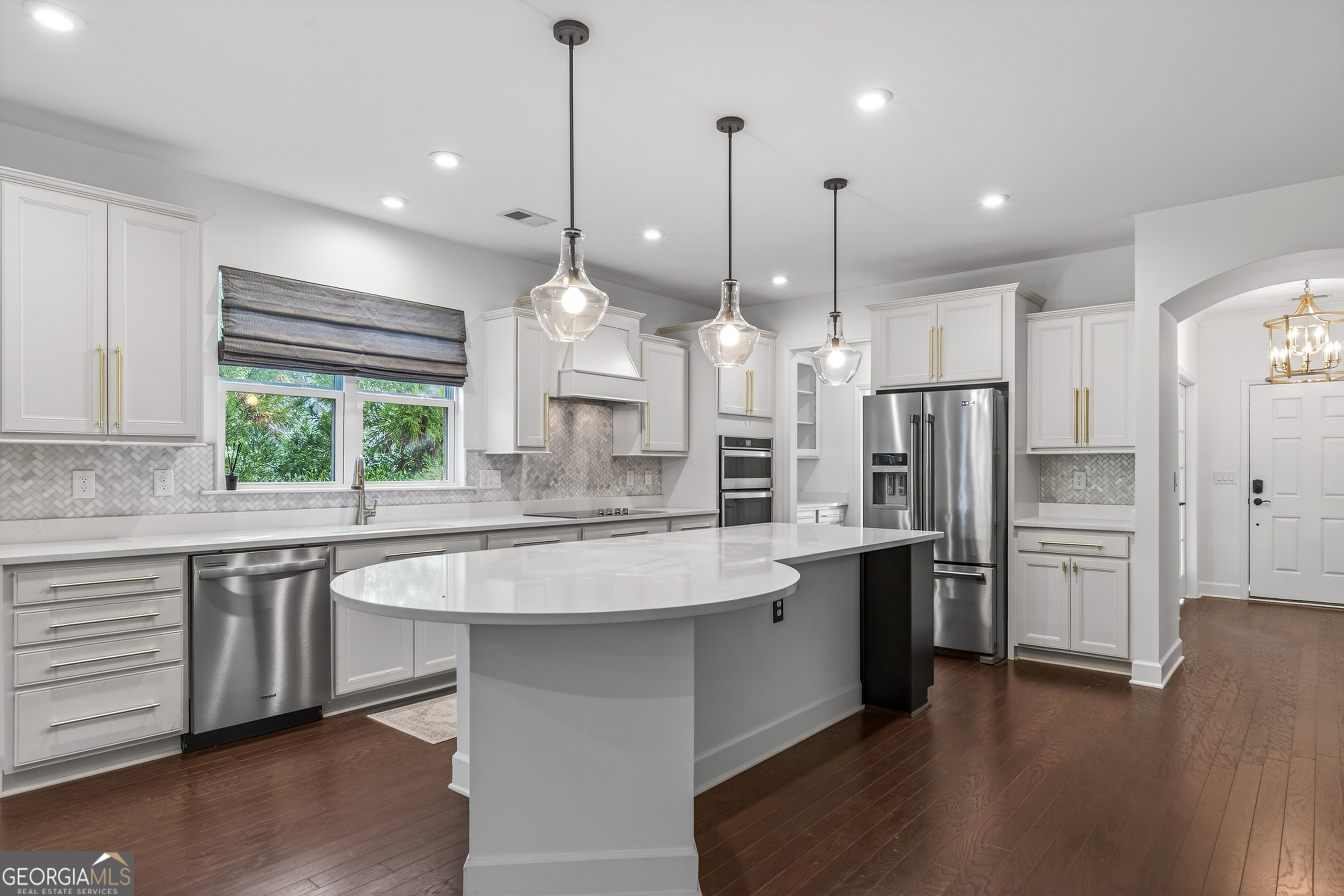 1060 Lone Oak Road Greensboro, GA 30642 - Photo 7 of 26 a large kitchen with stainless steel appliances kitchen island a large island in the center