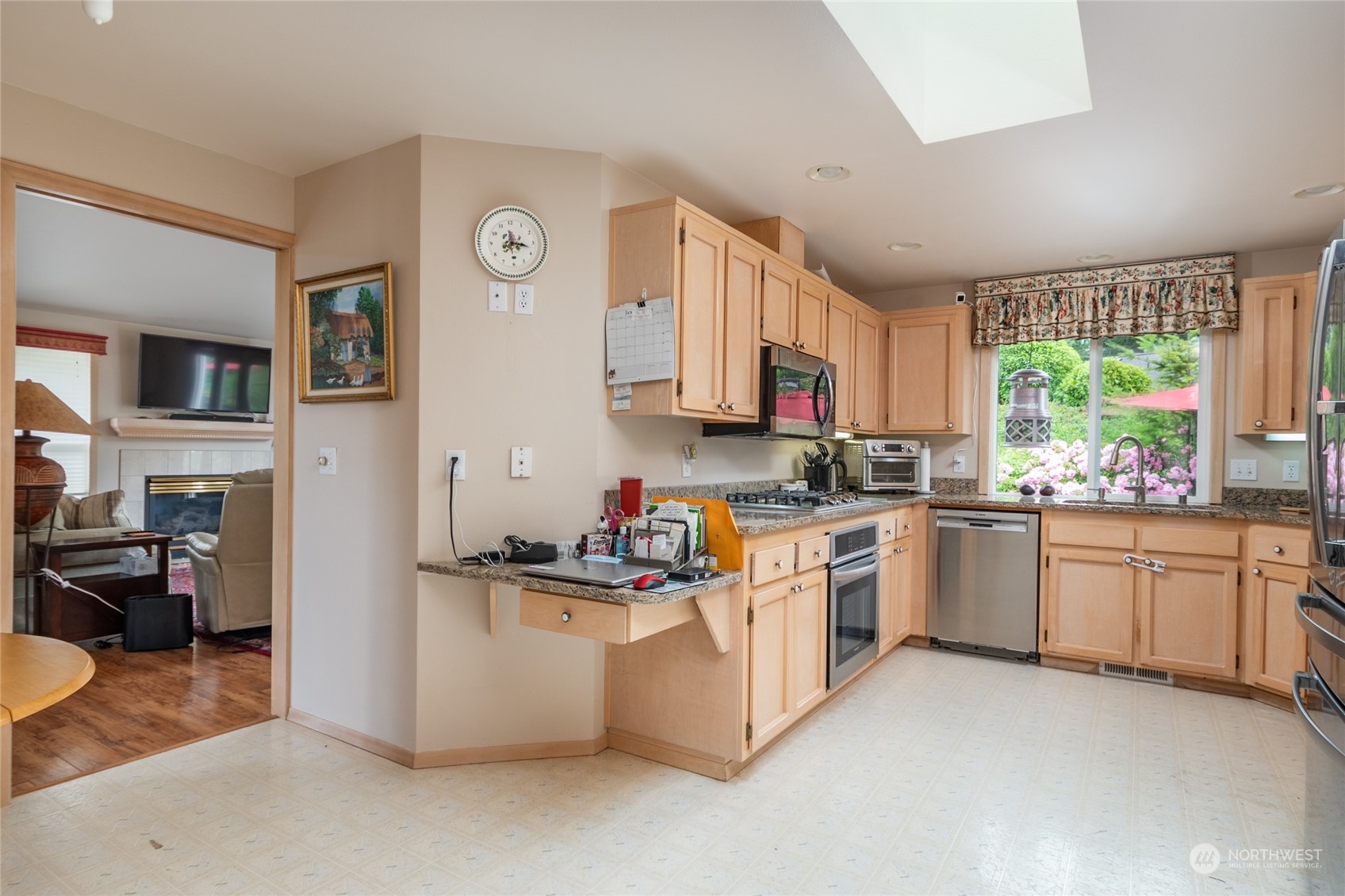 2475 Southwest Talon Loop Oak Harbor, WA 98277 - Photo 11 of 27 a kitchen with stainless steel appliances granite countertop a stove top oven a sink dishwasher a refrigerator and a stove