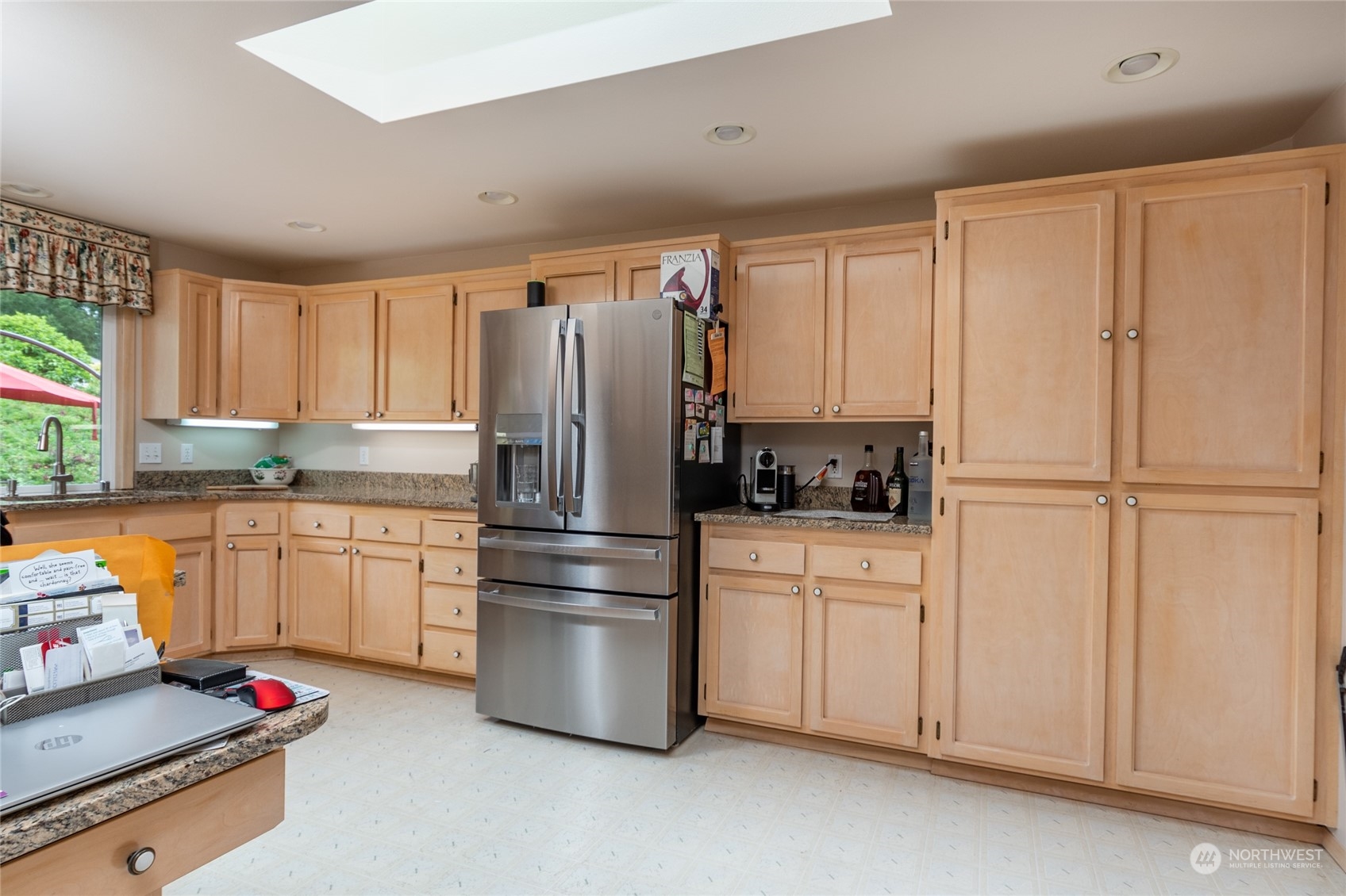 2475 Southwest Talon Loop Oak Harbor, WA 98277 - Photo 12 of 27 a kitchen with stainless steel appliances granite countertop a refrigerator sink and cabinets