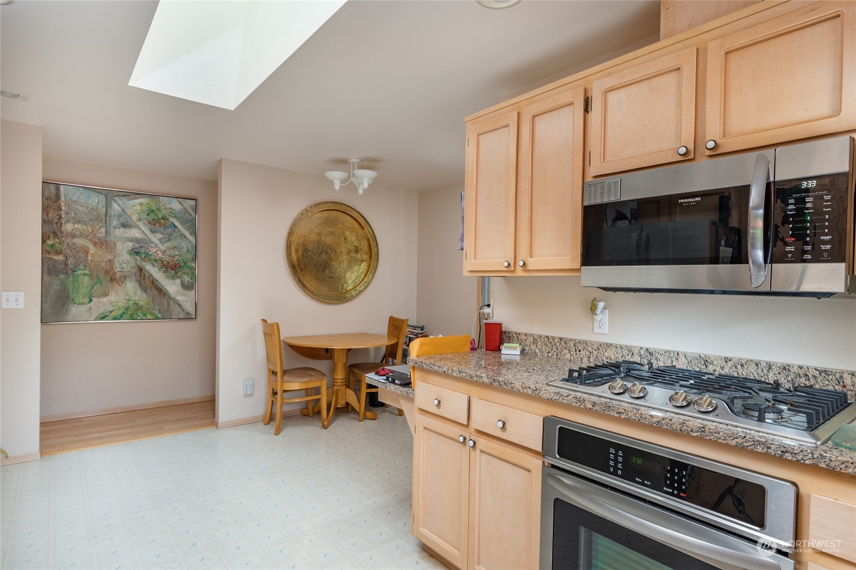 2475 Southwest Talon Loop Oak Harbor, WA 98277 - Photo 13 of 27 a kitchen with stainless steel appliances a stove a microwave and cabinets