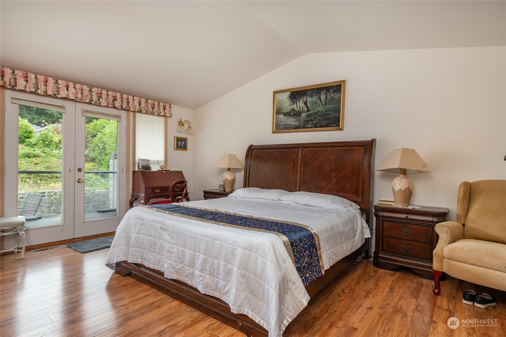 2475 Southwest Talon Loop Oak Harbor, WA 98277 - Photo 16 of 27 a bedroom with a bed a couch and a large window