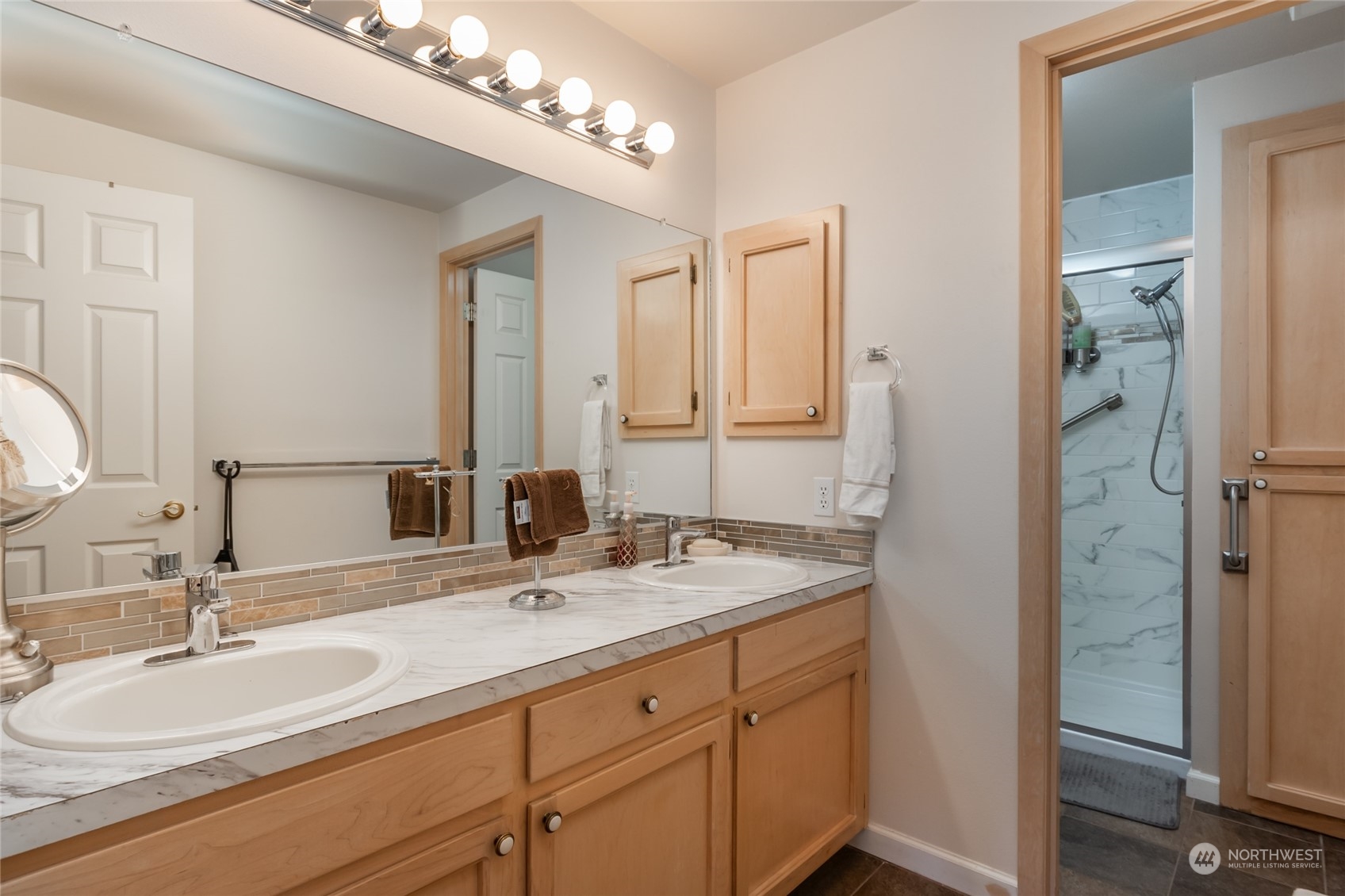 2475 Southwest Talon Loop Oak Harbor, WA 98277 - Photo 17 of 27 a bathroom with a double vanity sink and a mirror