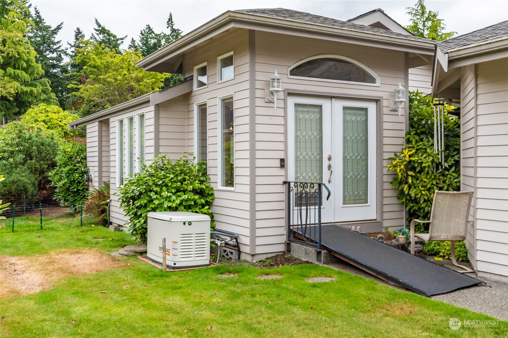 2475 Southwest Talon Loop Oak Harbor, WA 98277 - Photo 2 of 27 a front view of a house with a yard