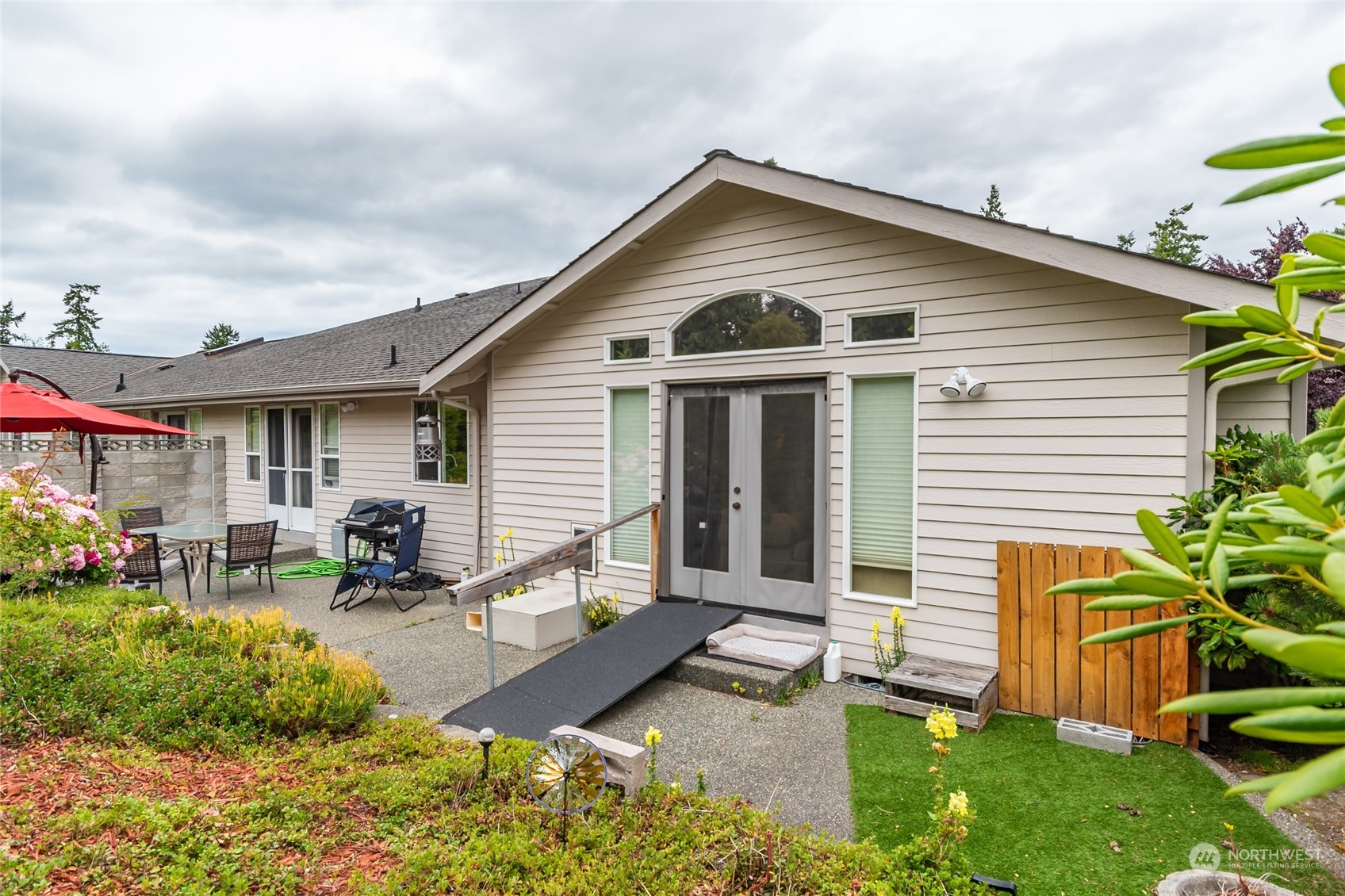 2475 Southwest Talon Loop Oak Harbor, WA 98277 - Photo 25 of 27 a front view of a house with garden