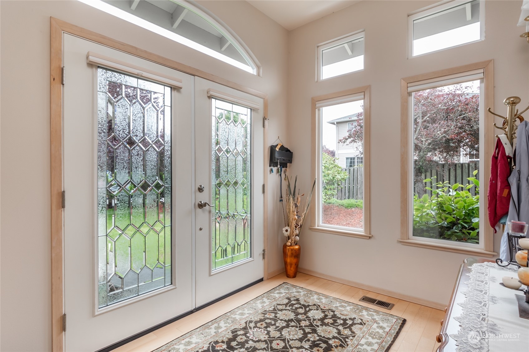 2475 Southwest Talon Loop Oak Harbor, WA 98277 - Photo 3 of 27 a view of an empty room with wooden floor and windows