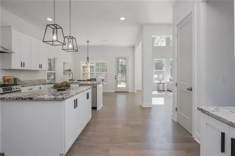 a view of an entryway with table and chair