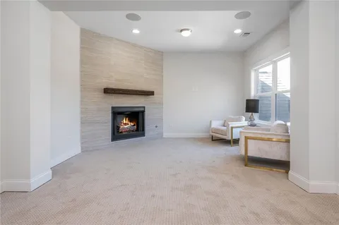 a spacious bathroom with a granite countertop sink and a mirror