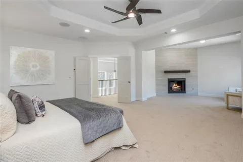 a bedroom with a bed and a fireplace