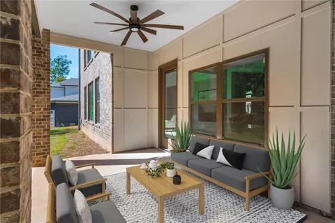 a living room with patio furniture and a window