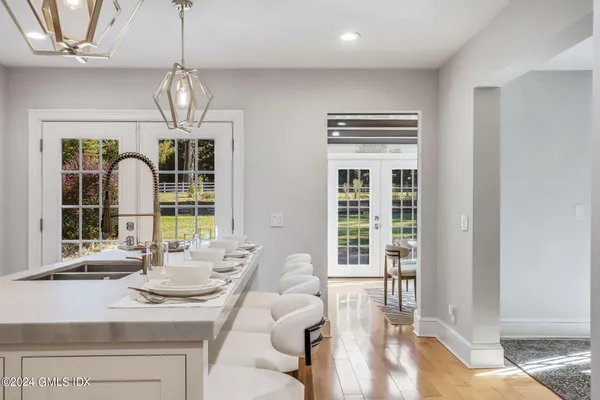 a kitchen with stainless steel appliances a stove a sink and cabinets