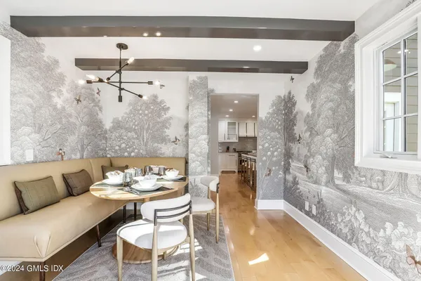 a view of a dining room with furniture window and outside view